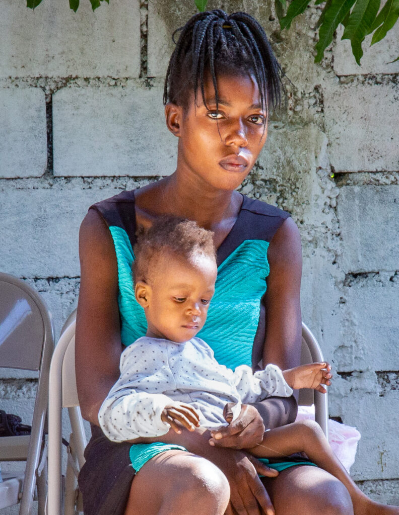 Mother and child receiving care through Lamp for Haiti