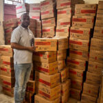 Lamp Manager Benoit Florestal with part of the UNICEF donation