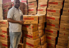 Lamp Manager Benoit Florestal with part of the UNICEF donation